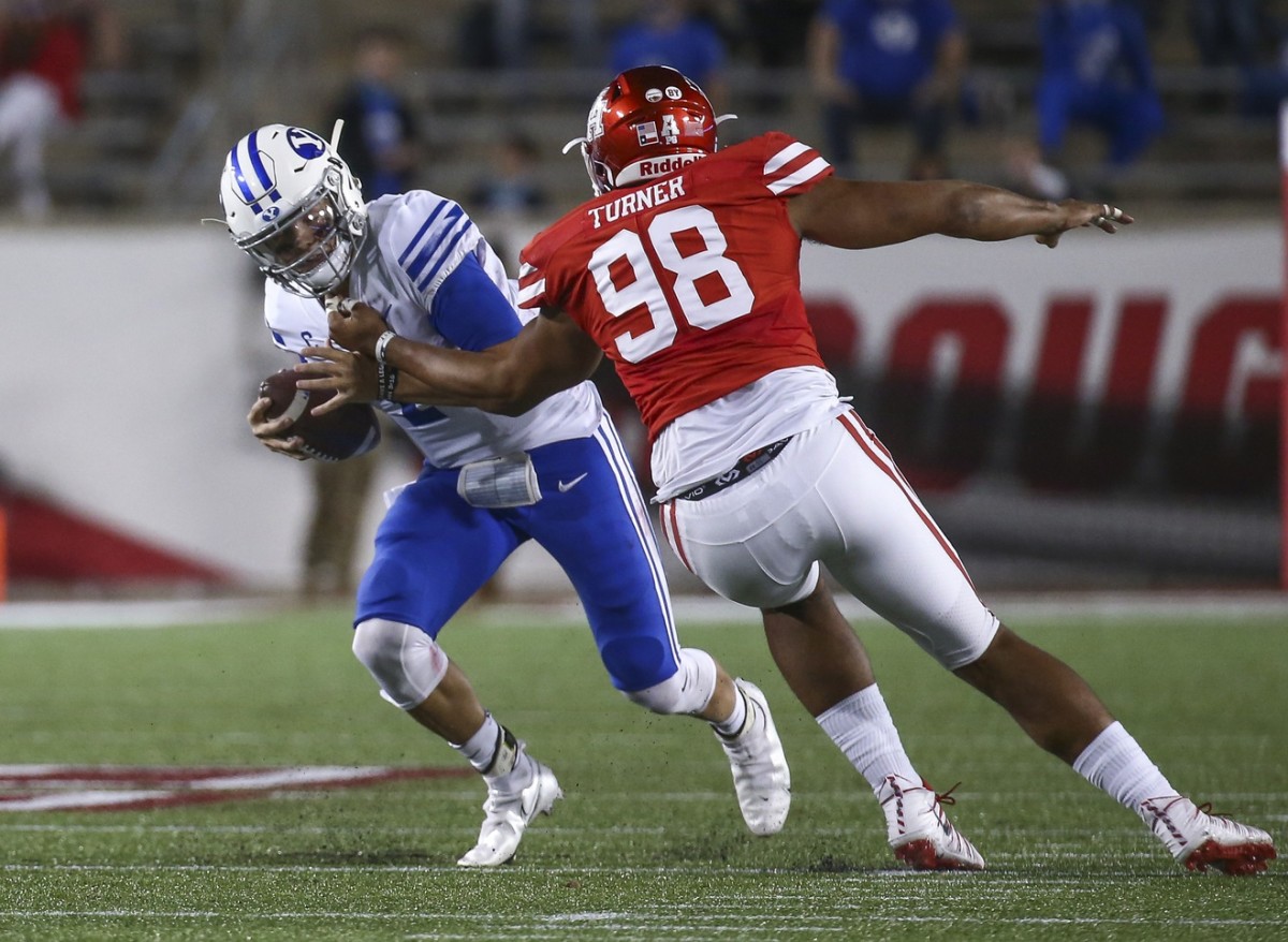 Brigham Young quarterback Zach Wilson (1) is sacked by Houston Cougars defensive lineman Payton Turner (98). Mandatory Credit: Troy Taormina-USA TODAY 